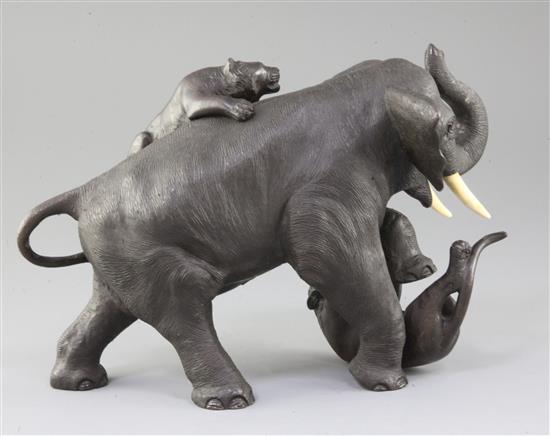 A Japanese bronze group of two tigers attacking an elephant, Meiji period, length 28cm height 18.5cm